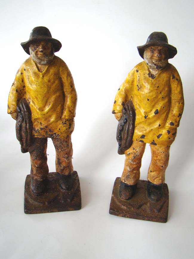 A pair of "OLD SALT" fisherman cast iron door stops circa 1890-1900